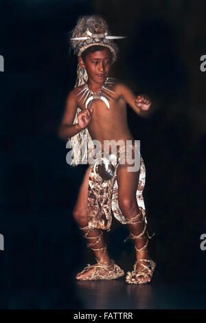 Polynesian boy in traditional clothing performing hula dance in Cook Islands Te Mire Ura, National Dancer of the Year, competition finals on Rarotonga Stock Photo