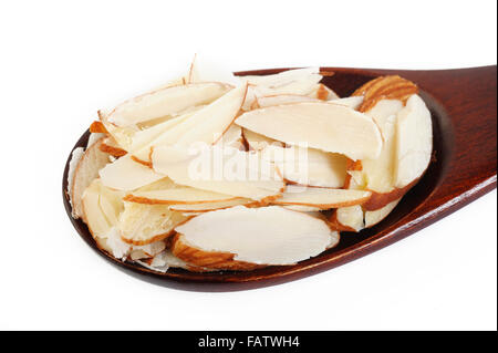 Sliced almonds in a wooden spoon Stock Photo