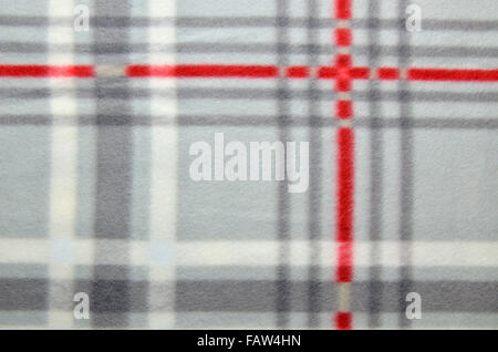 Close up of a plaid gray-red cozy blanket Stock Photo