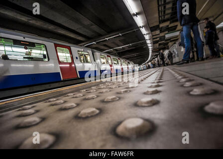 London underground station with tube train and platform Stock Photo