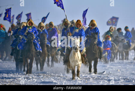 West Ujimqin Banner, China's Inner Mongolia Autonomous Region. 5th Jan, 2016. Herdsmen riding horses take part in an opening ceremony of horse folk culture in West Ujimqin Banner, north China's Inner Mongolia Autonomous Region, Jan. 5, 2016. Credit:  Ren Junchuan/Xinhua/Alamy Live News Stock Photo