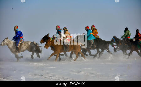 West Ujimqin Banner, China's Inner Mongolia Autonomous Region. 5th Jan, 2016. Herdsmen race horses in West Ujimqin Banner, north China's Inner Mongolia Autonomous Region, Jan. 5, 2016. Credit:  Ren Junchuan/Xinhua/Alamy Live News Stock Photo