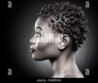 Black beauty with short spiky red hair Stock Photo