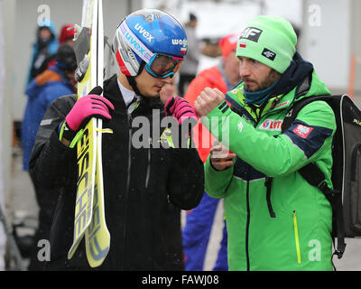 Bischofshofen, Austria. 05th Jan, 2016. Maciej Kot (L) of Poland is seen during the fourth stage of the Four Hills ski jumping tournament in Bischofshofen, Austria, 05 January 2016. Photo: Daniel Karmann/dpa/Alamy Live News Stock Photo