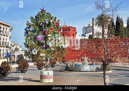 Moorish red castle walls in Plaza de la Constitucion Alhama de Granada ( 1482 the fortress town was taken from the Moorish Sultanate ) Spanish Spain Andalusia Stock Photo