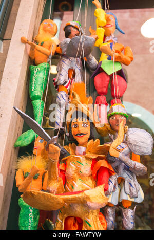 Puppet Sicily, view of colourful traditional papier mache puppets for sale on the Corso Umberto l in Taormina, Sicily. Stock Photo