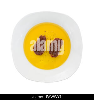Top view of sun dried tomatoes in olive oil on a plate isolated on a white background. Stock Photo