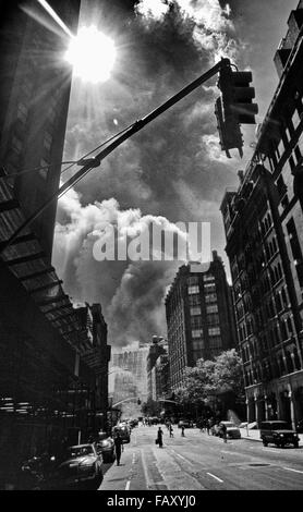 Smoke and dust spreading all over Manhattan during the collapse of the Twin Towers. Stock Photo