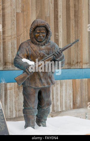 Muktuk Marsten Statue outside the Piuraagvik Recreation Center, Barrow, North Slope, Arctic Alaska, USA, Winter Stock Photo