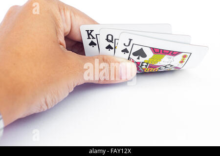 Playing cards in hand isolated on white background, stock photo Stock Photo