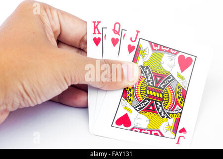 Playing cards in hand isolated on white background, stock photo Stock Photo