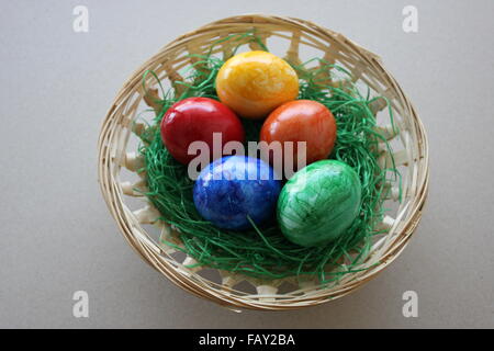 colored Easter Eggs in a basked Stock Photo