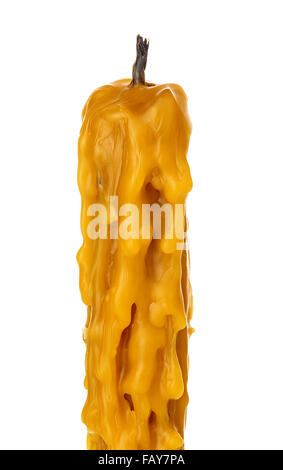Old vintage church burned candle wax close-up isolated on a white background. Stock Photo