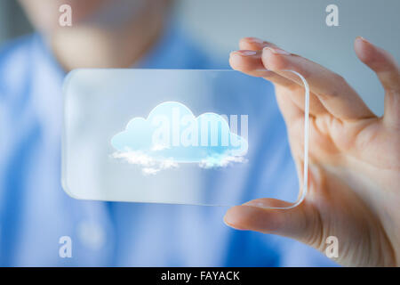 close up of woman with transparent smartphone Stock Photo