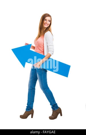 Beautiful woman walking while holding a blue arrow Stock Photo