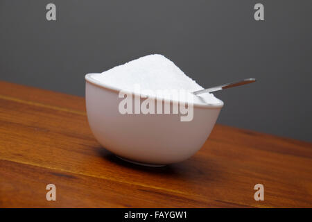 Granulated white sugar on teaspoon Stock Photo - Alamy