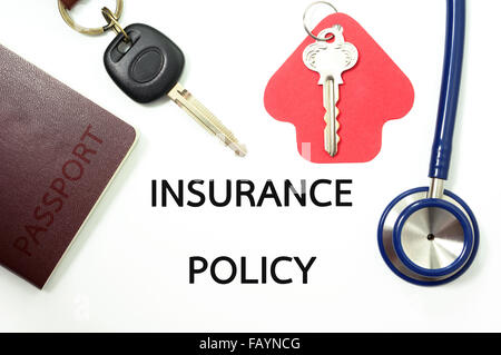 Insurance concept for many types of insurance with car key, house key, passport for travel and stethoscope Stock Photo