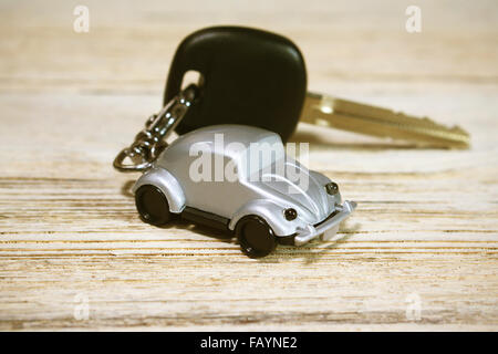 Car toy with car key on wood table Stock Photo