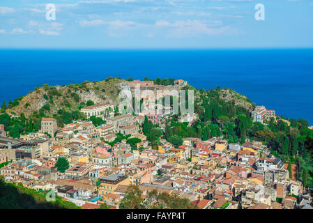 Taormina landscape Sicily, aerial cityscape view of Taormina, showing the auditorium of the ancient Greek theater (center). Stock Photo