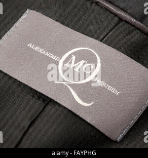 Inside label on elegant ladies evening jacket by British fashion icon Alexander McQueen Stock Photo