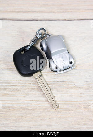 Car key with car toy on white wood table Stock Photo