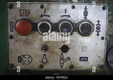 Color image of some buttons on a dirty old control panel. Stock Photo