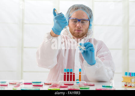 Scientists working with various samples Stock Photo