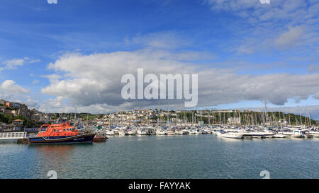 The Torbay Lifeboat and Prince William Marina with Brixham in the background viewed from the Victoria Breakwater, Brixham, Devon Stock Photo