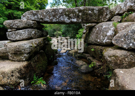 The remains of the ancient clapper bridge at Dartmeet, Dartmoor, Devon which crossed the East Dart River Stock Photo