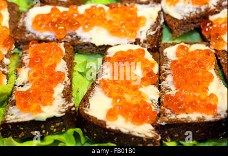 Delicious sandwiches with red caviar photographed close up Stock Photo