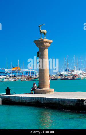 Mandraki harbour and fortress Agios Nicolaos in Rhodes town, Rhodes Island, Greece, UNESCO Stock Photo