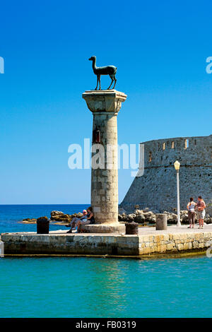 Mandraki harbour and fortress Agios Nicolaos in Rhodes town, Rhodes Island, Greece, UNESCO Stock Photo