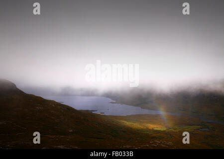 Scottish weather - Rainbow over Coigach (Sutherland, Assynt) Stock Photo