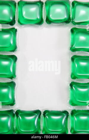 Liquid laundry detergent capsules - arranged for copy space, UK Stock Photo