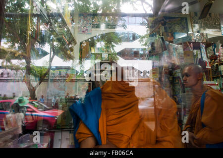 Monks in Prachan Amulet Market in Bangkok, Thailand. The amulet market in Bangkok, Thailand. Buddhist amulets for sale at the amulet market in Bangkok, Thailand Stock Photo