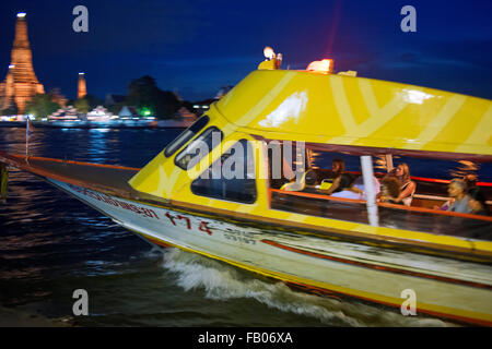 Chao Praya Express Boat at night. Bangkok, Public boat, ferry. Bangkok. Asia.  The Chao Phraya river makes a great way to get ar Stock Photo