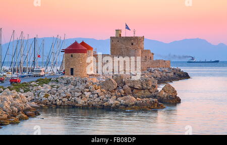 Mandraki harbour and fortress Agios Nicolaos in Rhodes town, Rhodes Island, Greece, UNESCO Stock Photo