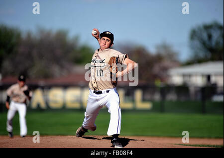 Pitcher releasing a pitch off the mound during a high school baseball game. USA. Stock Photo