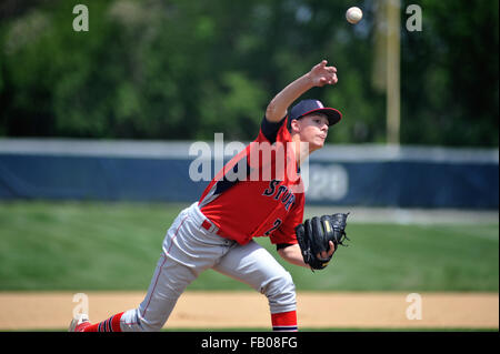 Pitcher releasing a pitch off the mound during a high school baseball game. USA. Stock Photo