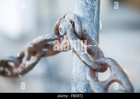 Fragment of rusty metal chain railing in Key West harbor, Florida. Stock Photo