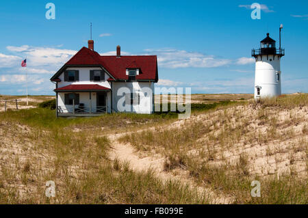 Visitors to Cape Cod can stay at Race Point lighthouse in the keeper's house in Provincetown, Massachusetts. It is in the Cape Cod National Seashore. Stock Photo