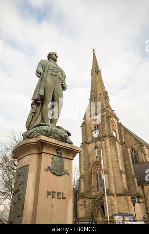 The Peel Memorial statue , Bury , with St Mary's Parish Church, Bury to the right Stock Photo