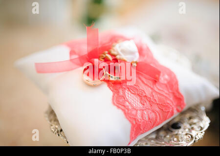 Wedding rings on pillow Stock Photo