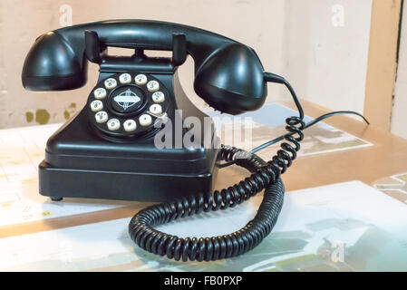 Old black bakelite telephone on a desk in Alcatraz prison Stock Photo