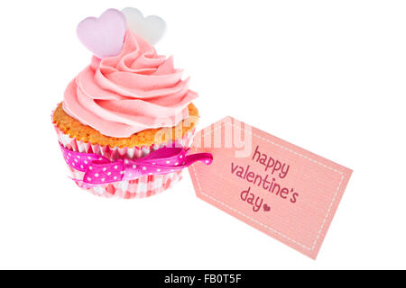 Pink Valentine cupcake with the words 'Happy Valentine's day' on a tag, isolated on white.