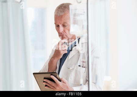 Doctor using tablet in hospital Stock Photo