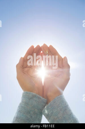 Female hands with sun Stock Photo - Alamy