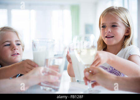 Family with son (4-5) and daughter (6-7) drinking refreshments Stock Photo