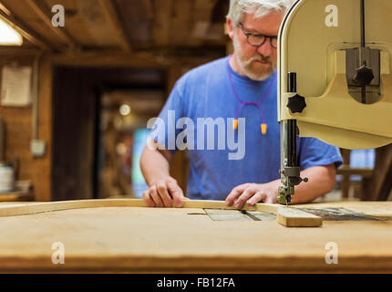 Carpenter working in workshop Stock Photo