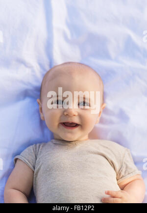 Portrait of baby boy (6-11 months) lying down Stock Photo